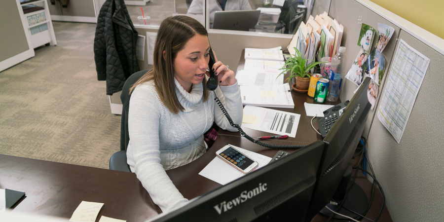 Logistics Management - receptionist at office desk