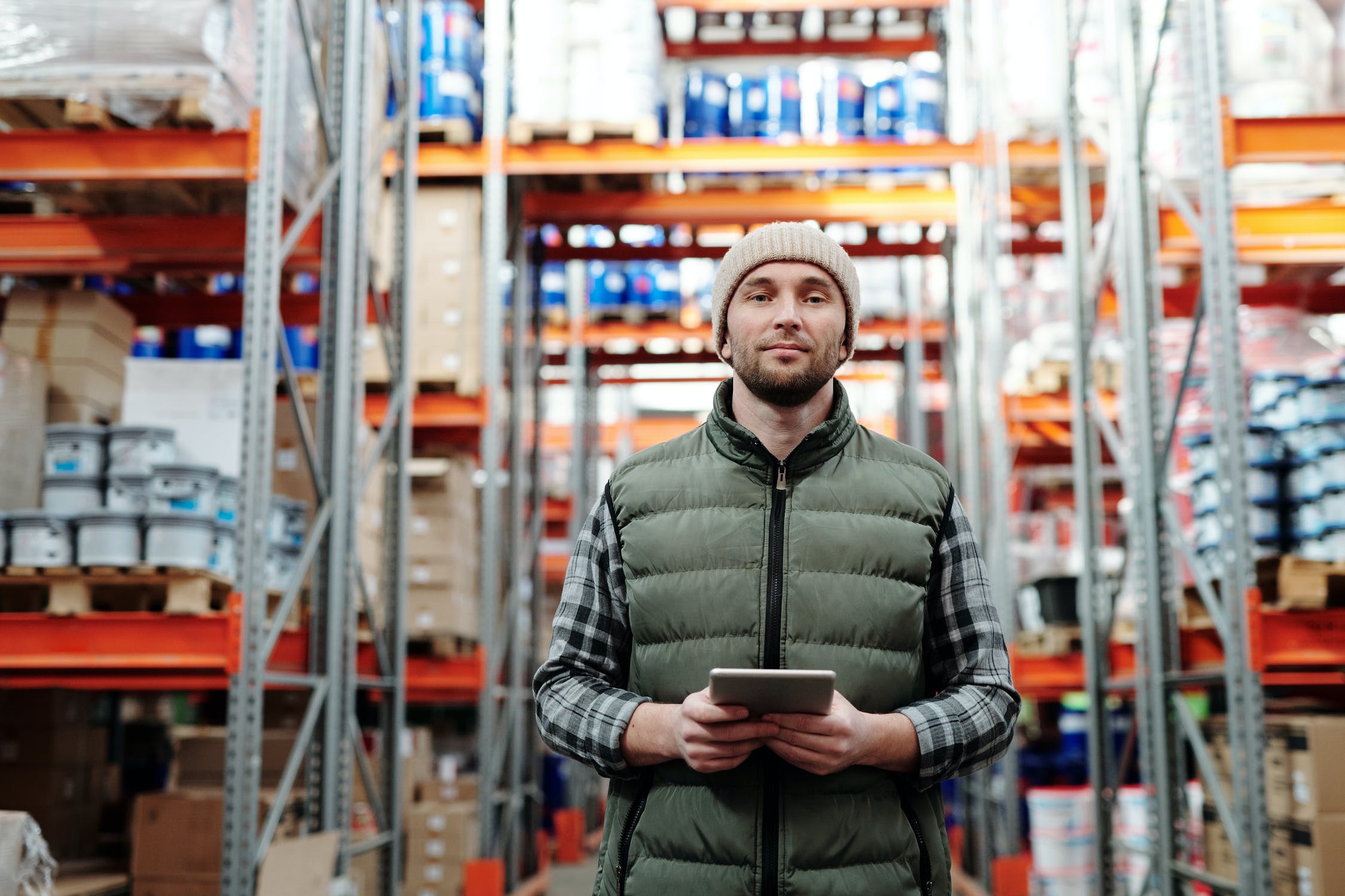 man with tablet in a warehouse